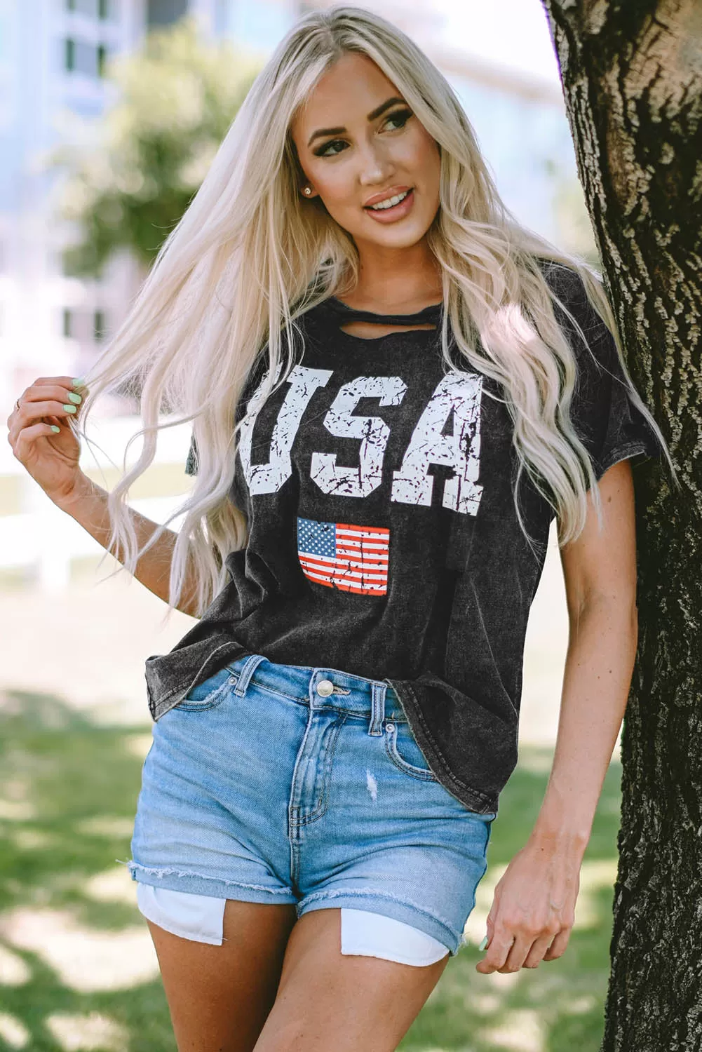 Celebrate America this Fourth of July with our USA Cutout Round Neck Short Sleeve T-Shirt, perfect for showing off your independence day spirit in style.